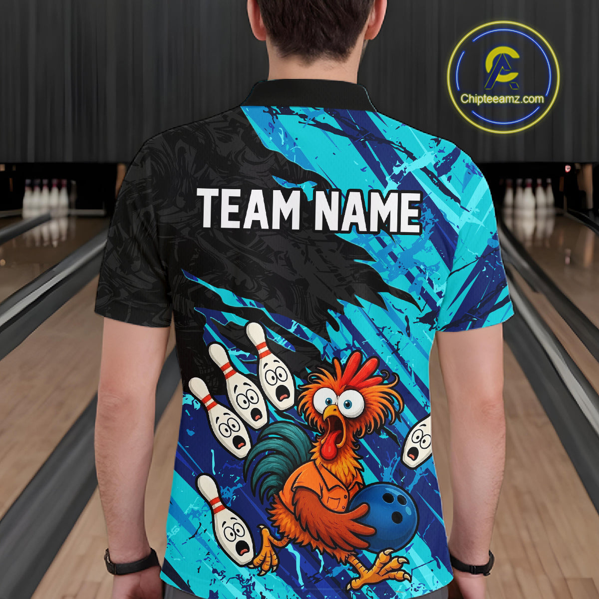 Male model wearing a custom cyan chicken bowling polo shirt back view displaying the personalized team name above a colorful bowling mascot graphic at the bowling alley