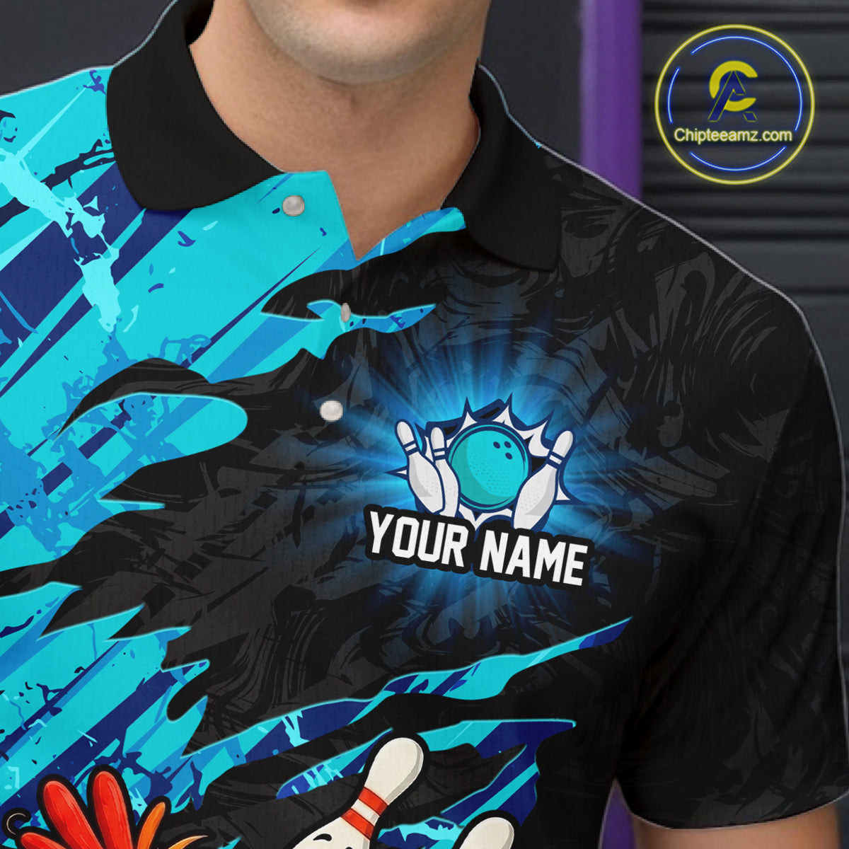 Close-up front view of a custom cyan chicken bowling polo shirt showing the personalized player name, colorful bowling mascot graphic and cyan abstract brush stroke design