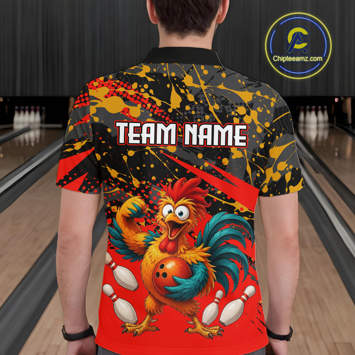 Male model wearing a custom black red rooster bowling polo shirt back view displaying the personalized team name above a fierce cartoon rooster graphic at the bowling alley