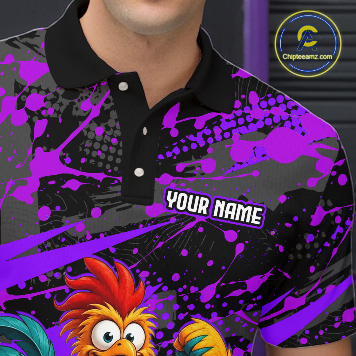 Close-up front view of a custom purple rooster bowling polo shirt showing the personalized player name, fierce cartoon rooster graphic and purple black paint splash design