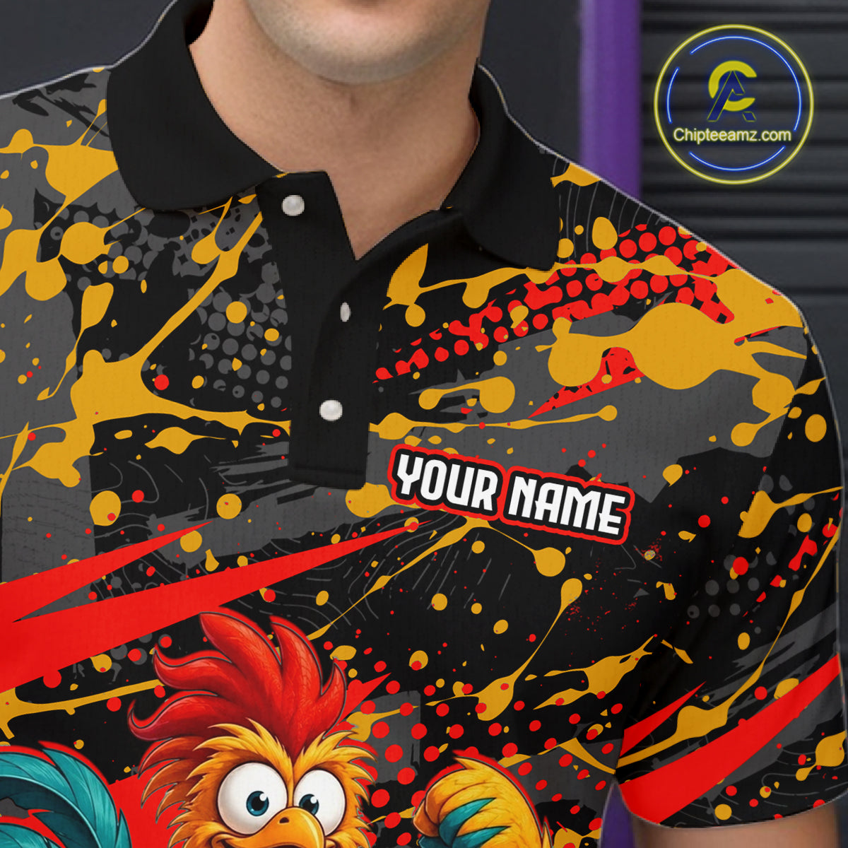 Close-up front view of a custom black red rooster bowling polo shirt showing the personalized player name, fierce cartoon rooster graphic and red black paint splash design