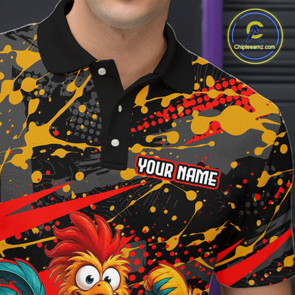 Close-up front view of a custom black red rooster bowling polo shirt showing the personalized player name, fierce cartoon rooster graphic and red black paint splash design
