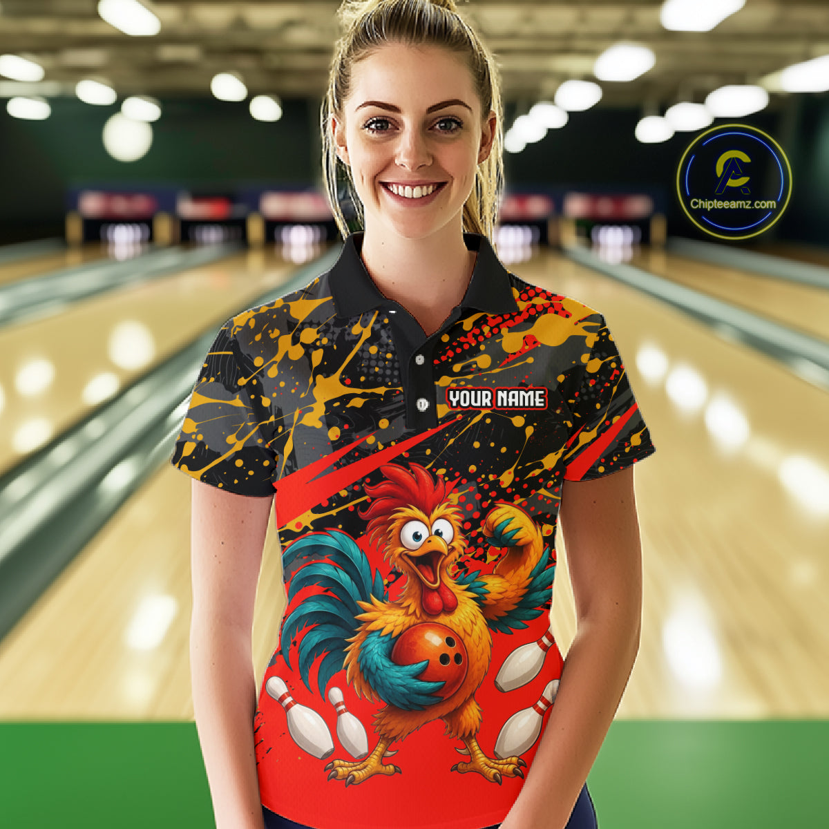 Female model wearing a custom black red rooster bowling polo shirt front view featuring a fierce cartoon rooster, bowling ball, bowling pins and red black paint splash pattern at the bowling alley