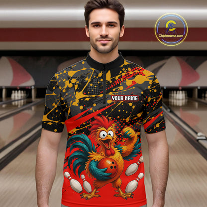 Male model wearing a custom black red rooster bowling quarter-zip shirt front view featuring a fierce cartoon rooster, bowling ball, bowling pins and red black paint splash pattern at the bowling alley
