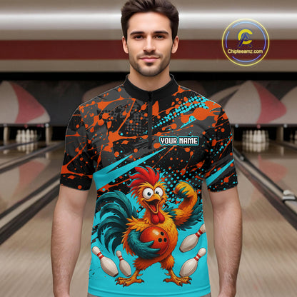 Male model wearing a custom black turquoise rooster bowling quarter-zip shirt front view featuring a fierce cartoon rooster, bowling ball, bowling pins and turquoise orange paint splash pattern at the bowling alley
