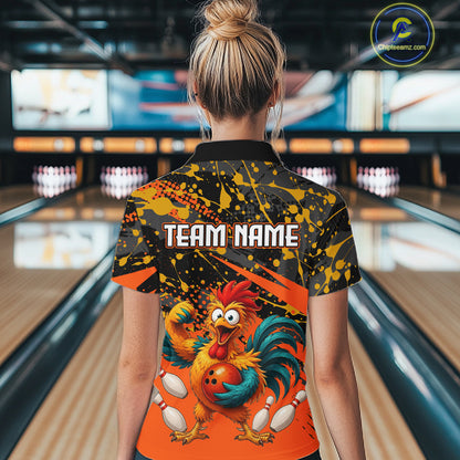 Female model wearing a custom orange rooster bowling polo shirt back view displaying the personalized team name above a fierce cartoon rooster graphic at the bowling alley