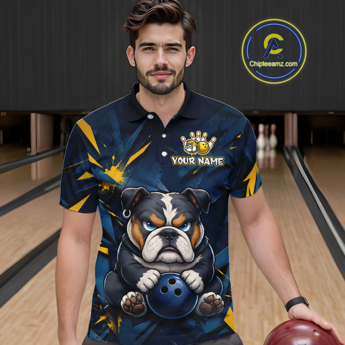 Male model wearing a custom blue bulldog bowling polo shirt front view featuring a fierce cartoon bulldog, bowling ball, gold lightning accents and navy blue abstract pattern at the bowling alley