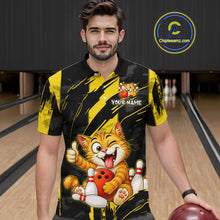 Load image into Gallery viewer, Male model wearing a custom black yellow cat bowling polo shirt front view featuring a playful cartoon cat, bowling ball, bowling pins and yellow black paint stroke pattern at the bowling alley
