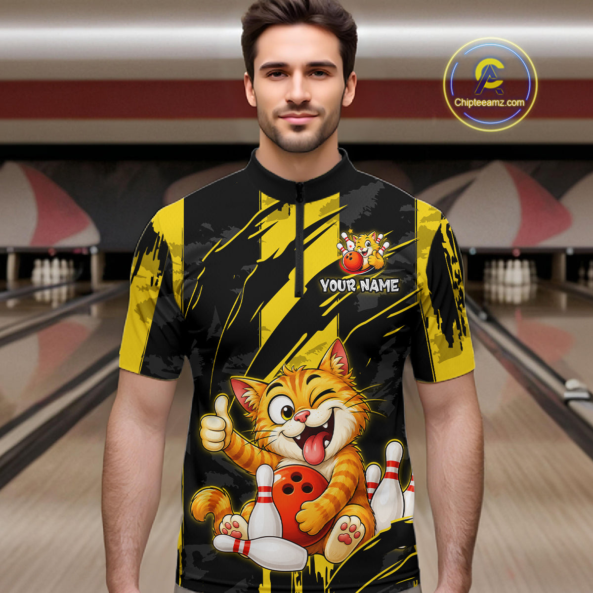 Male model wearing a custom black yellow cat bowling quarter-zip shirt front view featuring a playful cartoon cat, bowling ball, bowling pins and yellow black paint stroke pattern at the bowling alley