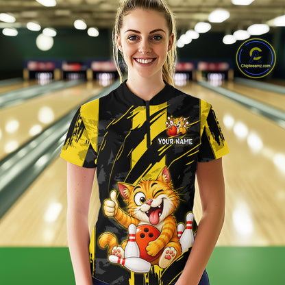 Female model wearing a custom black yellow cat bowling quarter-zip shirt front view featuring a playful cartoon cat, bowling ball, bowling pins and yellow black paint stroke pattern at the bowling alley