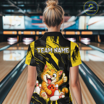 Female model wearing a custom black yellow cat bowling polo shirt back view displaying the personalized team name above a playful cartoon cat graphic at the bowling alley