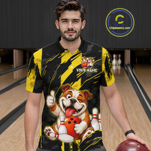 Load image into Gallery viewer, Male model wearing a custom black yellow bulldog bowling polo shirt front view featuring a playful cartoon bulldog, bowling ball, bowling pins and yellow black paint stroke pattern at the bowling all
