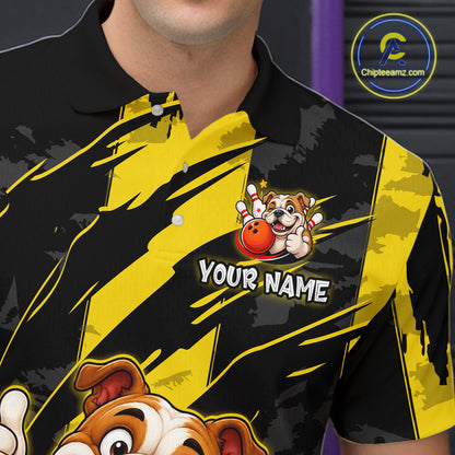 Close-up front view of a custom black yellow bulldog bowling polo shirt showing the personalized player name, playful cartoon bulldog graphic and yellow black paint stroke design