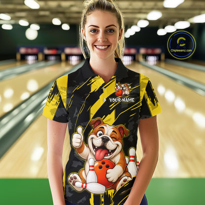 Female model wearing a custom black yellow bulldog bowling polo shirt front view featuring a playful cartoon bulldog, bowling ball, bowling pins and yellow black paint stroke pattern at the bowling all