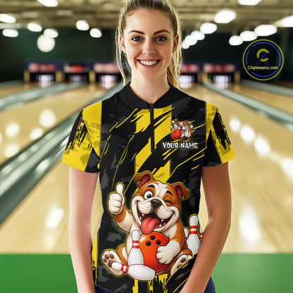 Female model wearing a custom black yellow bulldog bowling quarter-zip shirt front view featuring a playful cartoon bulldog, bowling ball, bowling pins and yellow black paint stroke pattern at the bowling alley