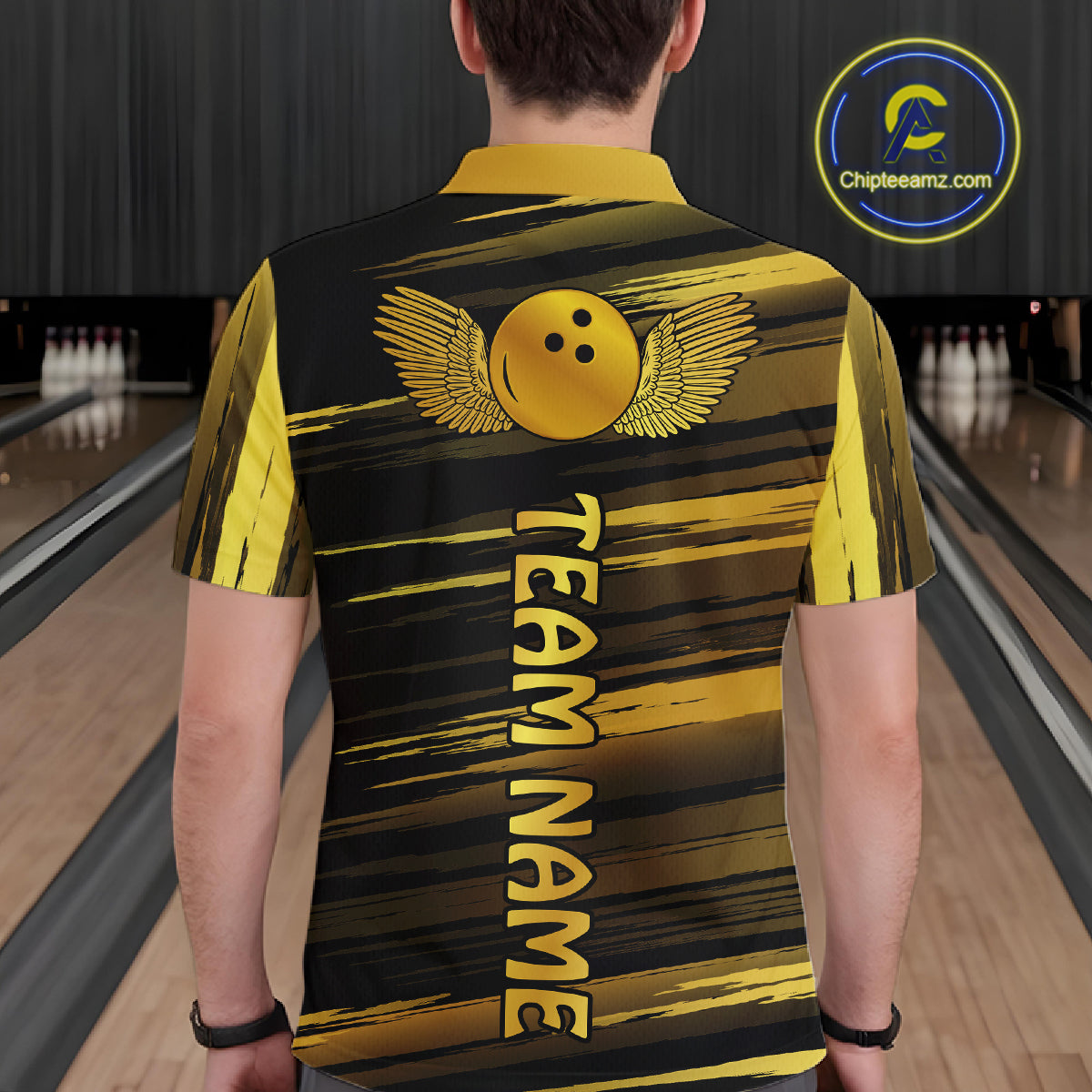 Male model wearing a custom black gold bowling polo shirt back view displaying the personalized team name below a gold bowling ball emblem at the bowling alley