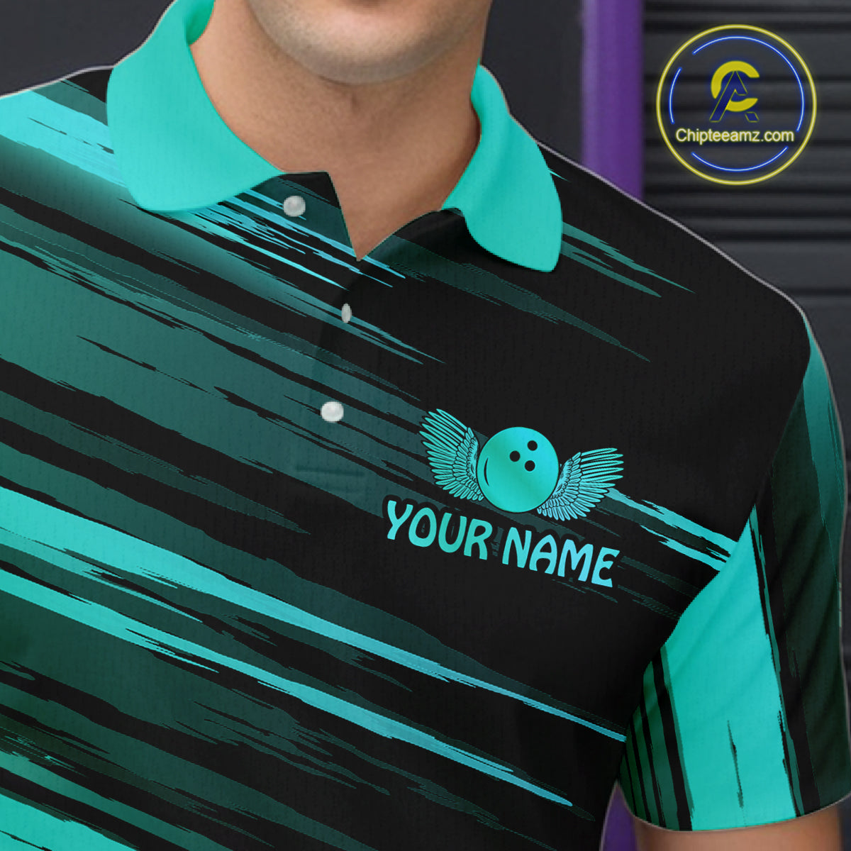 Close-up front view of a custom black turquoise bowling polo shirt showing the personalized player name, turquoise bowling ball emblem and dynamic gold brush stroke des