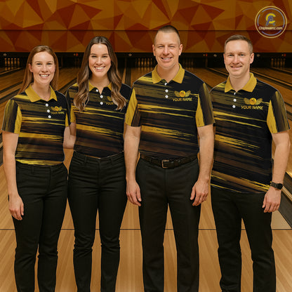 Group of four wearing custom black gold bowling shirts front view featuring gold bowling ball emblem, dynamic gold brush stroke pattern and striped design at the bowling alley