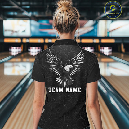 Male model wearing a custom black patriotic bowling polo shirt back view displaying the personalized team name below a spread-wing bald eagle graphic at the bowling alley