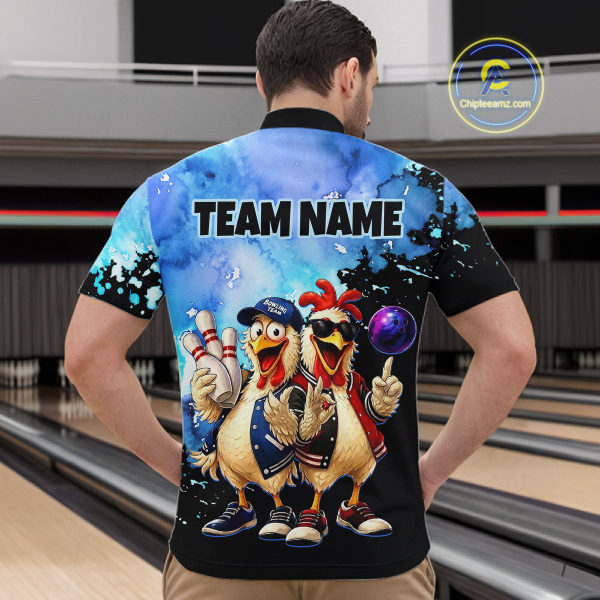 Person wearing a colorful bowling-themed shirt with cartoon chickens on a bowling alley.