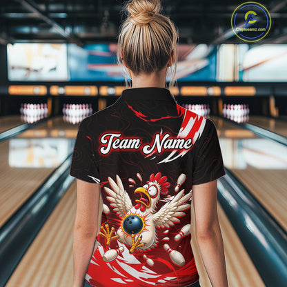 Person wearing a black bowling shirt with a chicken design and 'Team Name' text in a bowling alley.