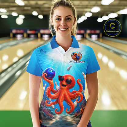 Person wearing a blue bowling shirt with an octopus design in a bowling alley.