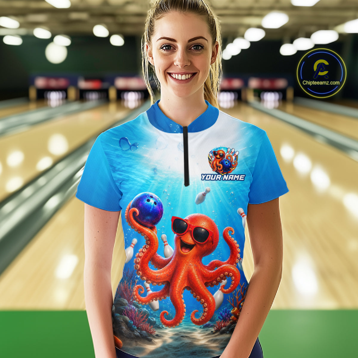 Person wearing a blue bowling shirt with an octopus design in a bowling alley.