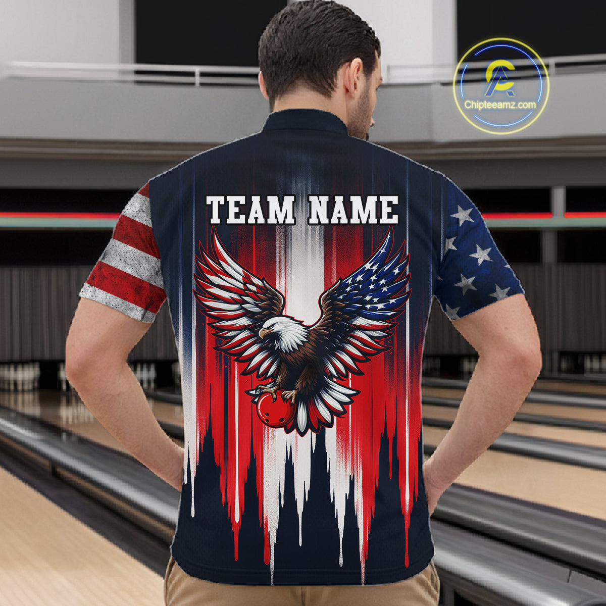 Person wearing a bowling shirt with an eagle design and 'Team Name' text at a bowling alley.