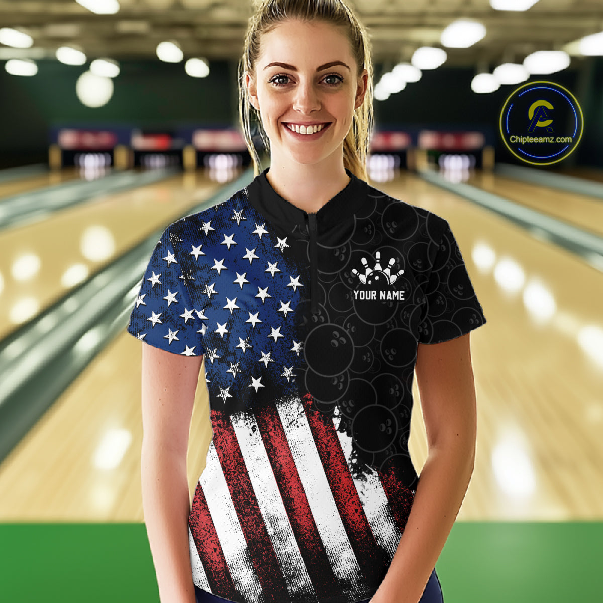 Person wearing a bowling shirt with American flag design in a bowling alley.