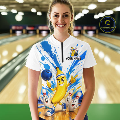 Person wearing a colorful bowling shirt with cartoon characters in a bowling alley.