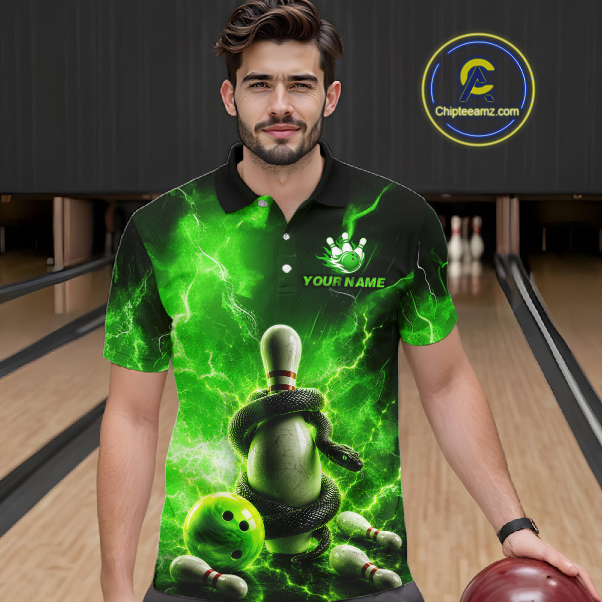 Man wearing a green bowling-themed shirt with a snake design in a bowling alley.