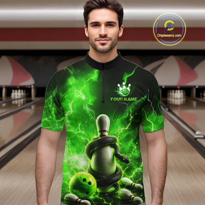 Man wearing a green and black bowling shirt with a unique design in a bowling alley.