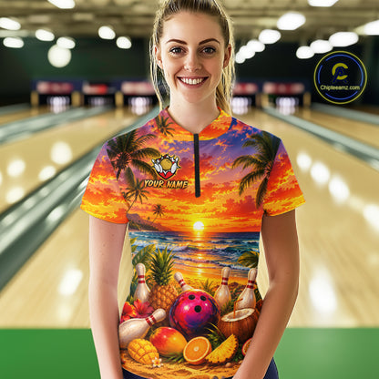 Person wearing a colorful bowling shirt with a tropical design in a bowling alley.