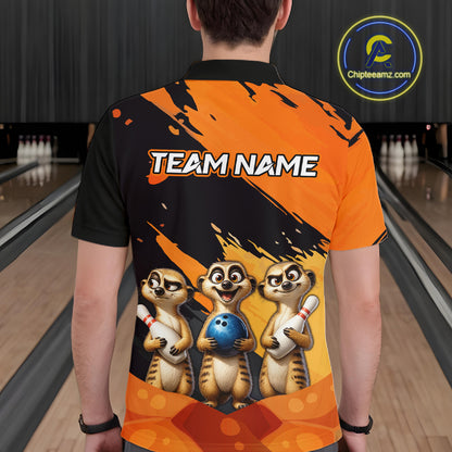 A person viewed from behind wearing a short-sleeve bowling-themed polo shirt with a black and orange graphic design, three cartoon meerkats holding bowling balls and pins, and the text 'TEAM NAME' across the upper back. Bowling lanes are visible in the background