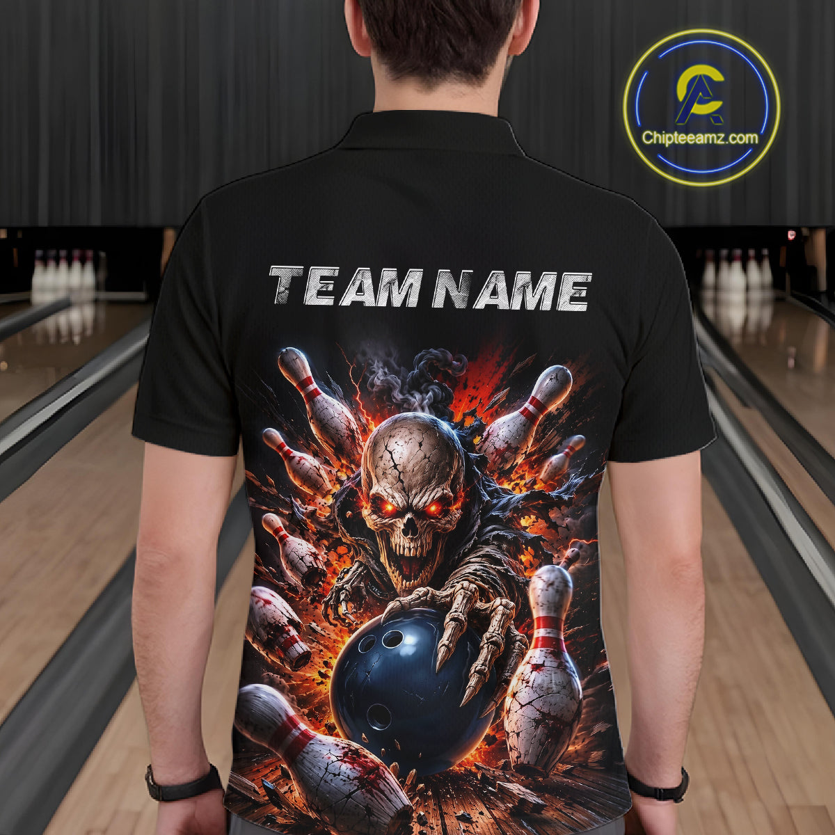 Person wearing a black polo shirt with a graphic design of a skeleton bowling and 'TEAM NAME' text on a bowling alley background.