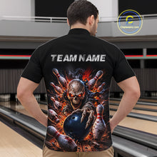 Load image into Gallery viewer, Person wearing a black quarter-zip jersey with a graphic design of a skeleton holding a bowling ball and pins, with 'TEAM NAME' text on the back, in a bowling alley.