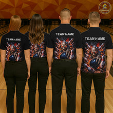 Load image into Gallery viewer, Four people wearing black shirts with team name and graphic designs on a bowling alley.