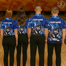 Load image into Gallery viewer, Four people wearing blue bowling shirts with a cat design on a bowling alley.