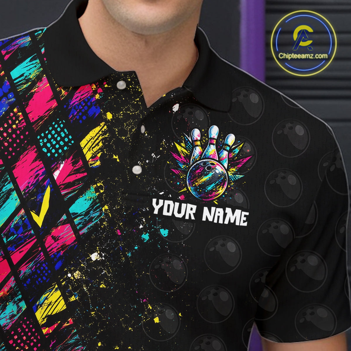 Black polo shirt with colorful design and 'Your Name' text, brand logo visible