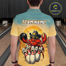 Load image into Gallery viewer, Person wearing a colorful shirt with a cartoon crab design and 'TEAM NAME' text in a bowling alley.