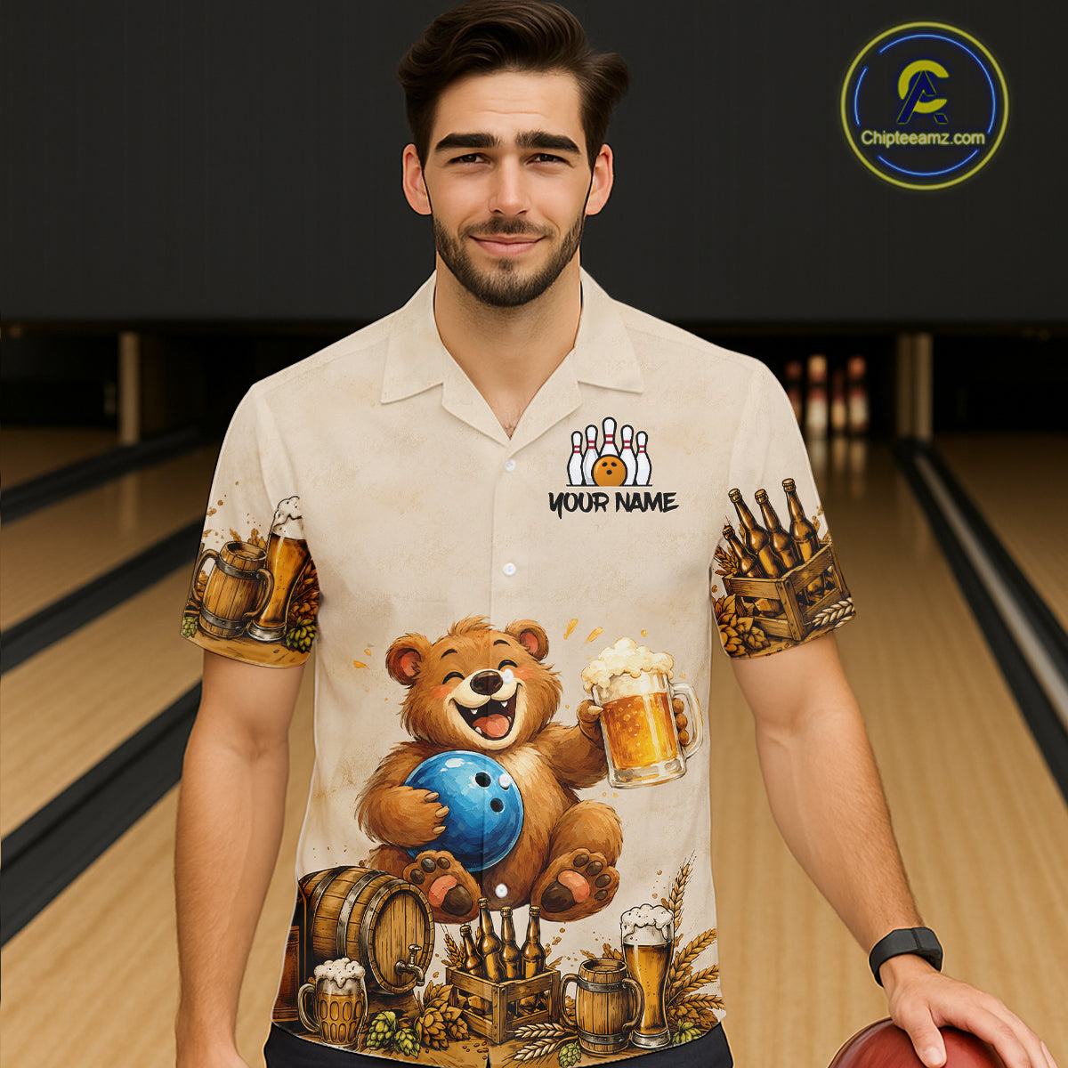 Man wearing a shirt with a bear bowling design in a bowling alley.