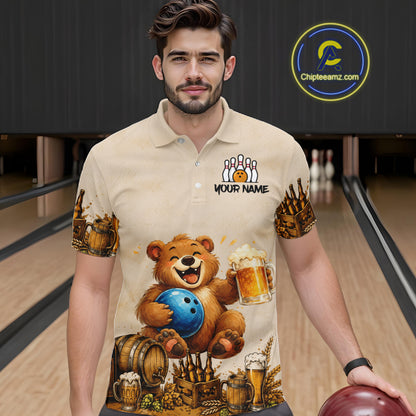 Man wearing a shirt with a bear holding a bowling ball and beer design in a bowling alley.