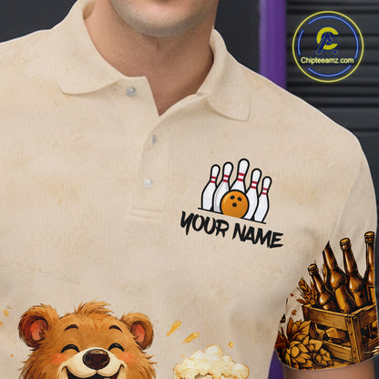 Beige polo shirt with various designs including a bear, bowling pins, and a beer mug.