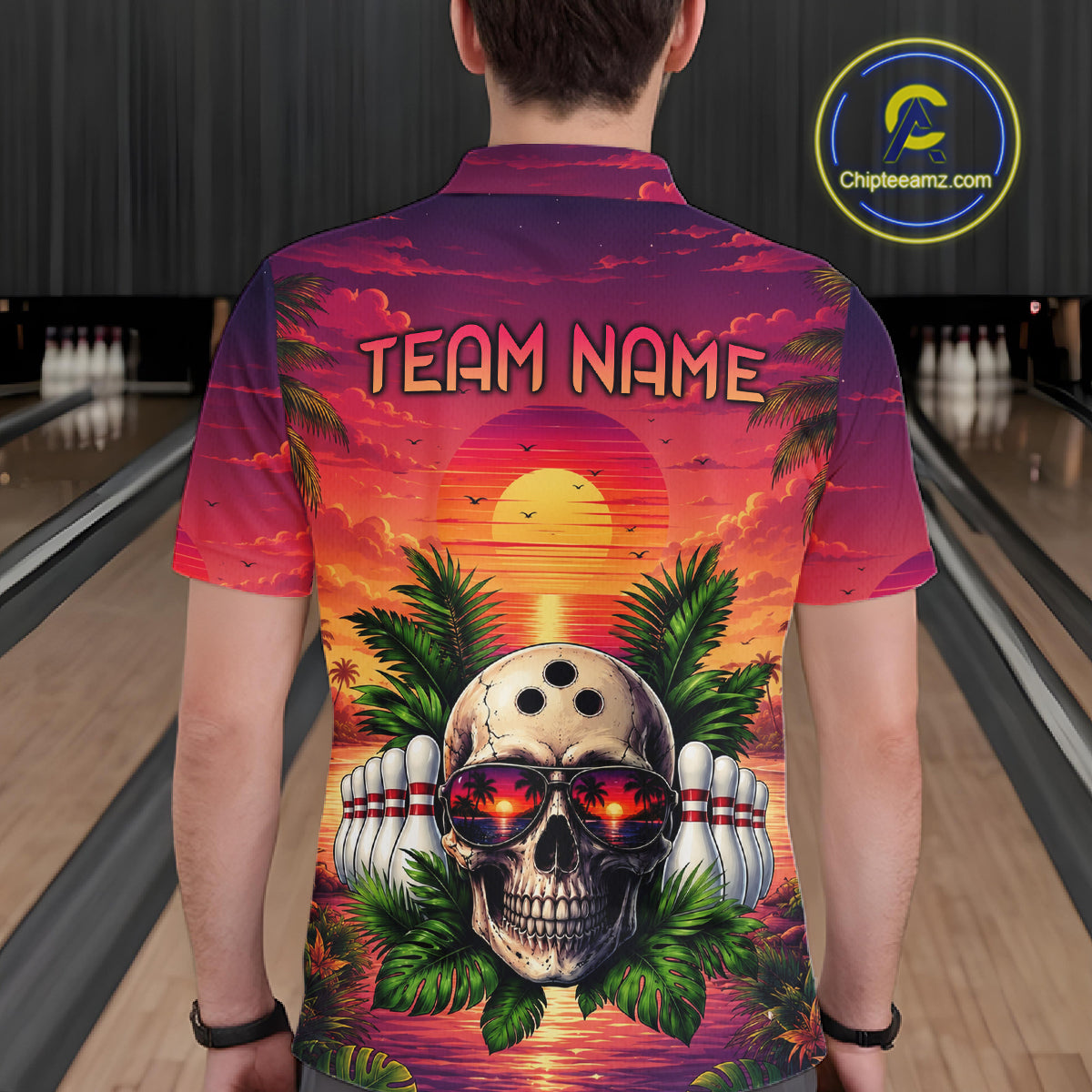 Person wearing a colorful shirt with a skull design and 'TEAM NAME' text in a bowling alley.