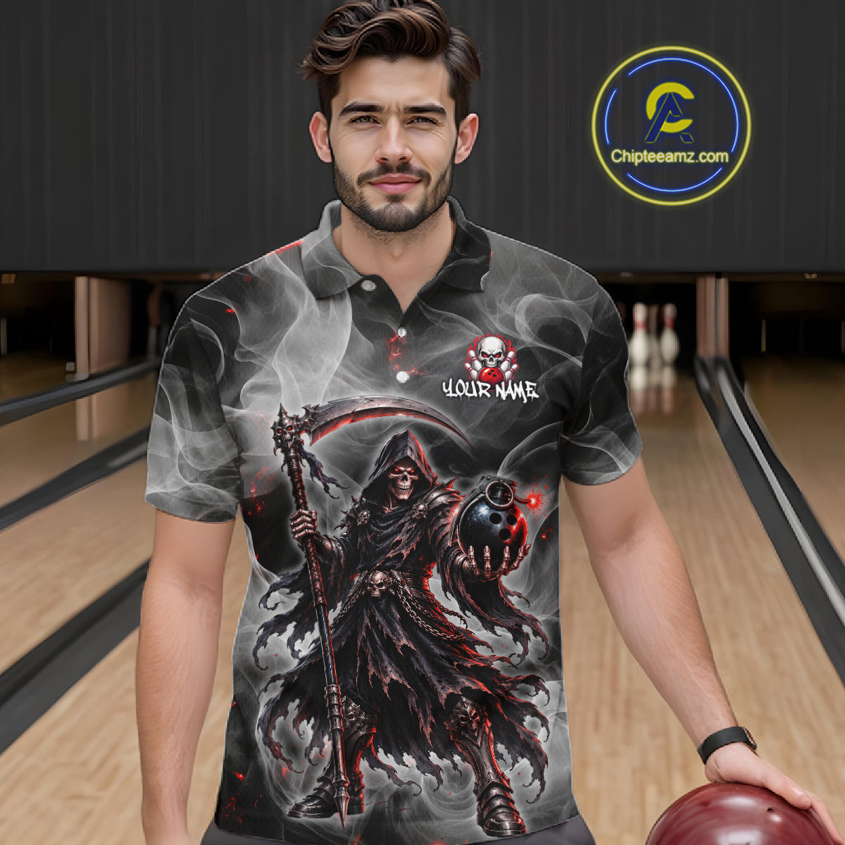 A man wearing a custom printed short-sleeve polo shirt with a grim reaper graphic, standing in a bowling alley. The shirt features a dark design with a smoking reaper, a scythe, and a skull-and-crossbones logo with the text 'YOUR NAME'.
