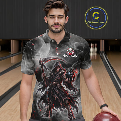 A man wearing a custom printed short-sleeve polo shirt with a grim reaper graphic, standing in a bowling alley. The shirt features a dark design with a smoking reaper, a scythe, and a skull-and-crossbones logo with the text 'YOUR NAME'.