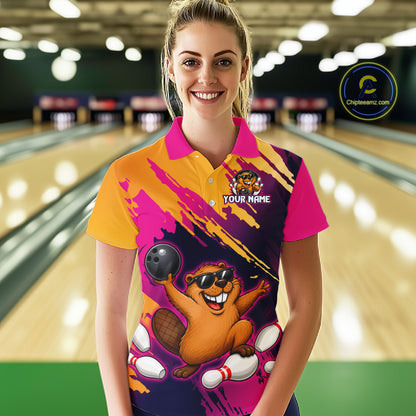Person wearing a colorful bowling shirt with a cartoon character in a bowling alley.