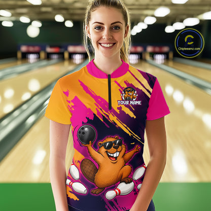 Person wearing a colorful bowling shirt with a design of a beaver and text 'Your Name' in a bowling alley.
