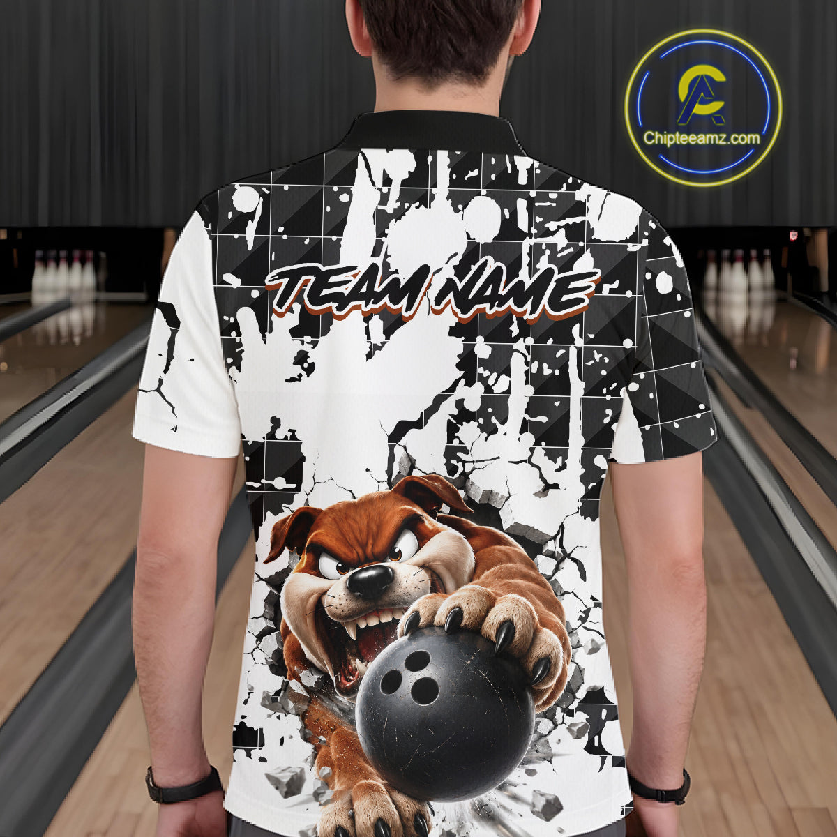 Person wearing a bowling-themed shirt with a dog graphic in a bowling alley.