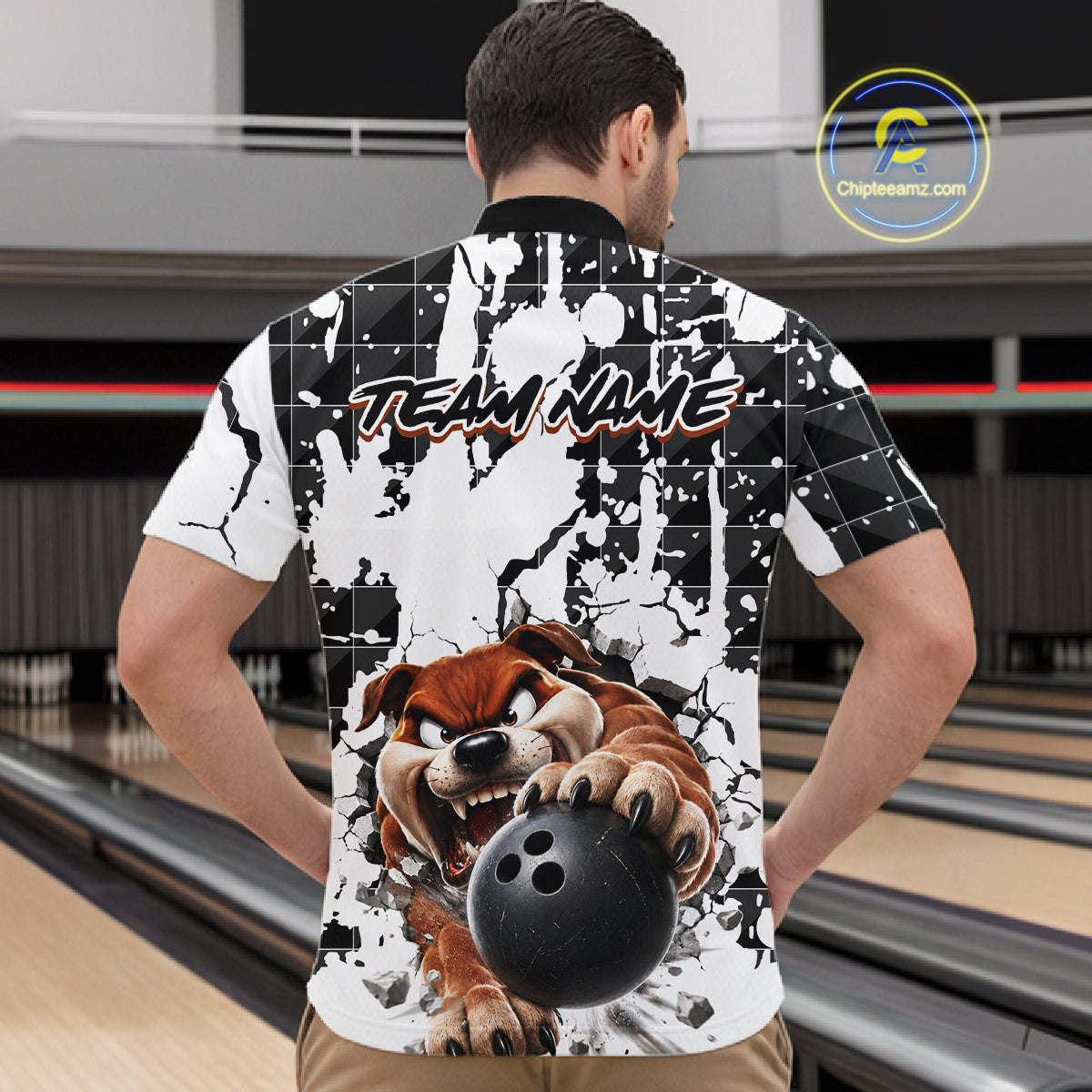 Person wearing a bowling-themed shirt with a dog holding a bowling ball design in a bowling alley.